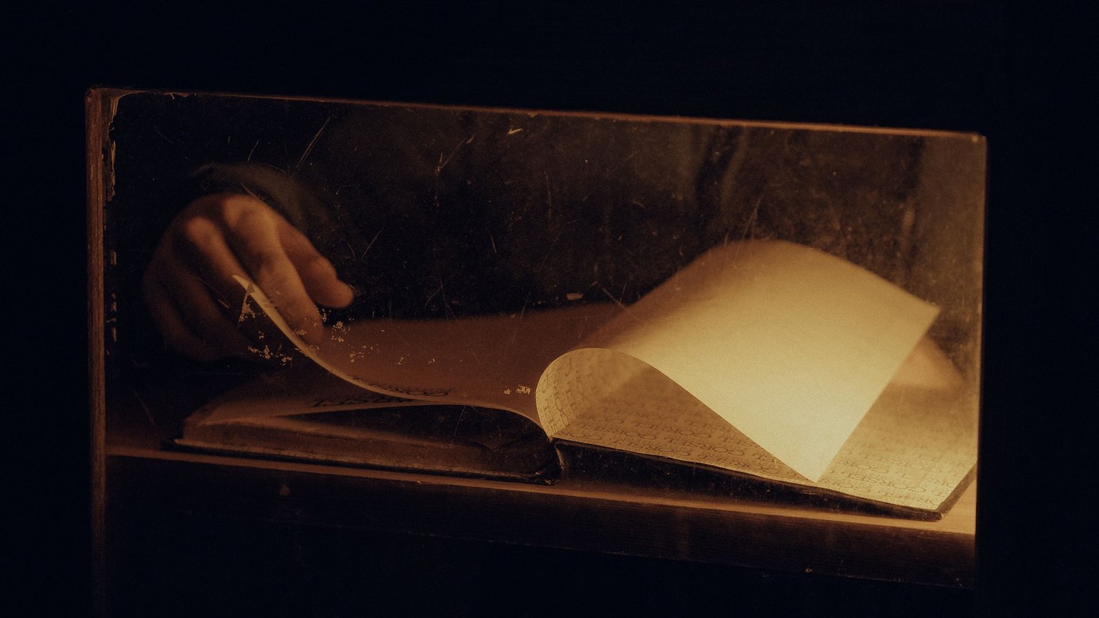 Person reading a physical book in quiet natural light — replacing screen time with offline activities improves well-being.