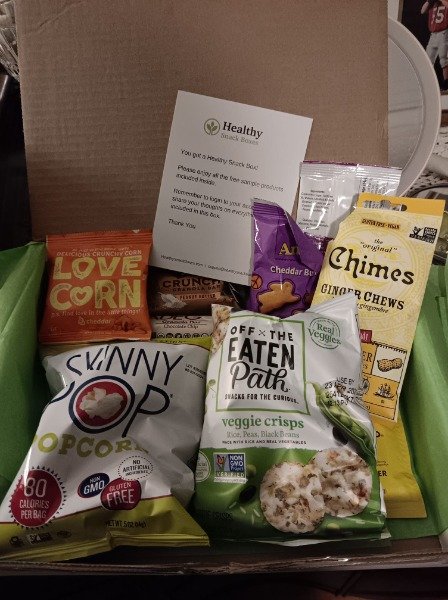 Open snack box — SkinnyPop, Love Corn, Off the Eaten Path