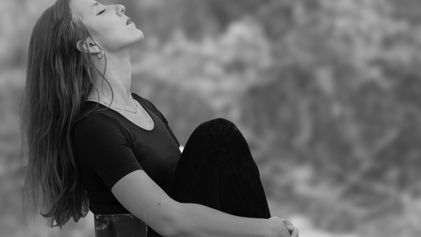 Person practicing meditation in a calm natural setting — stimulating the vagus nerve through relaxation techniques.