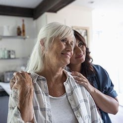 Relieved patient and family member at home
